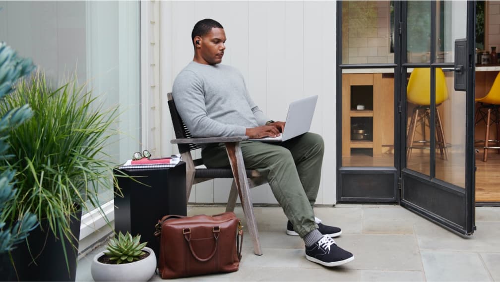 Man in chair with lap-top